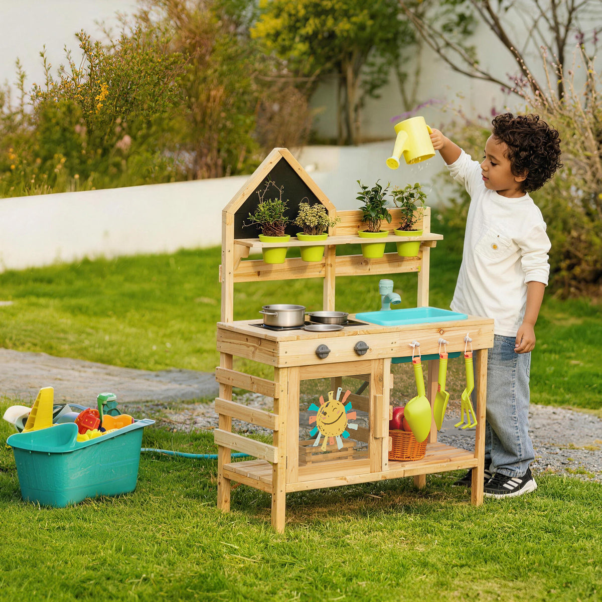 Child playing with a wooden mud kitchen outdoors by Guanyi Toys