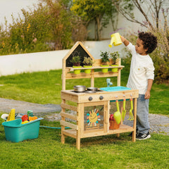 Child playing with a wooden mud kitchen outdoors by Guanyi Toys